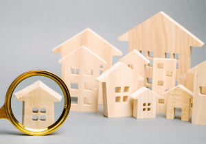 KCP Legal Services Magnifying Glass with Houses Home Closing Sale Blog