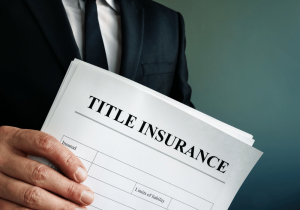 KCP Legal Services Person Holding Title Insurance Contract Title Insurance Blog